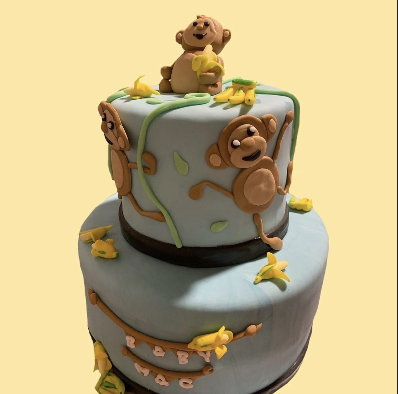 Wooden ice-bucket cake holding mini whiskey bottles on sugar ice